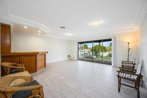a large room with white walls and a large window at Liverpool Oasis 5BR Home for Groups and Families in Liverpool