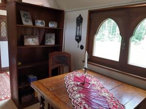 a dining room with a table with a candle on it at Zigappo Orientale in Lychen