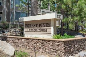 a sign for a forest pines apartment building at Cartwright Corner Condo townhouse in Incline Village