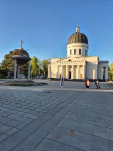 a building with a dome on top of it at Cathedral Park Medium Apartment in Chişinău +13 photos