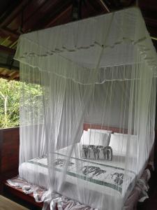 Rúm í herbergi á Dambulla Tree House