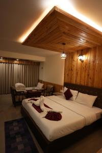 Voodi või voodid majutusasutuse Hotel Monal toas