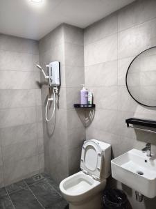 a bathroom with a shower and a toilet and a sink at TR12 tulip elmina 5pax Big cinema movie 1 free parking in Shah Alam
