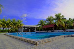 a large swimming pool in front of a resort at Hotel Sol del Oriente Iquitos in Iquitos