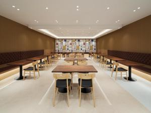 a large dining room with tables and chairs at Wecostay Gangnam in Seoul