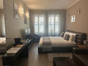 Postel nebo postele na pokoji v ubytování Milhouse Suite Vitruvio