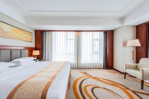 Postel nebo postele na pokoji v ubytování Dandong Xin An Dong Hotel + 234 fotografií