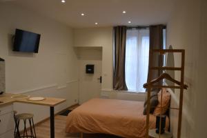 Postel nebo postele na pokoji v ubytování Appartement Ô Arcades
