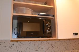 Kuchyň nebo kuchyňský kout v ubytování Appartement Ô Arcades