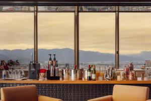 a bar with a view of the mountains at Kokusai 21 International Hotel in Nagano +93 photos