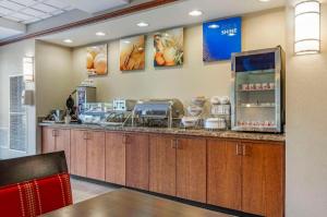 a fast food restaurant with a counter with food at Comfort Suites in French Lick