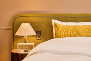 Postel nebo postele na pokoji v ubytování ARQ Paleis Hotel