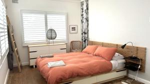 Ένα ή περισσότερα κρεβάτια σε δωμάτιο στο 10 Warri Cres, Pet Friendly