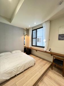 Una cama o camas en una habitación de JuYi 5 fotos más