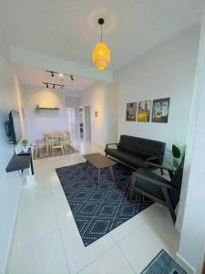 Гостиная зона в OYO Home 90978 Bq's Studio Homestay Bajet Alor Setar +62 фотографии