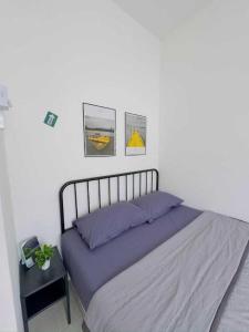 Кровать или кровати в номере OYO Home 90978 Bq's Studio Homestay Bajet Alor Setar