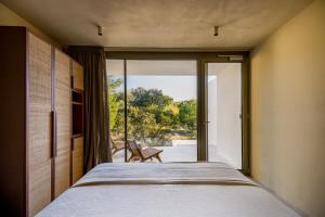 Postel nebo postele na pokoji v ubytování Botanico Villa & Suites
