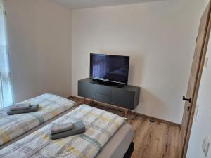 Letto o letti in una camera di Happy Nest