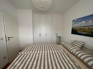 En eller flere senge i et værelse på Ferienwohnung Kiebitzwiese