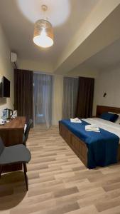 Postel nebo postele na pokoji v ubytování Green Hotel Tskaltubo