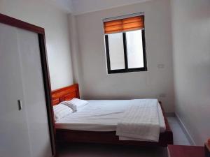Ένα ή περισσότερα κρεβάτια σε δωμάτιο στο Catimor Hotel