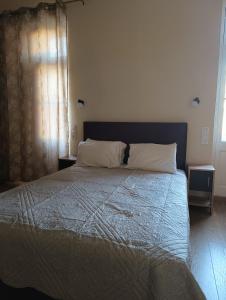 Postel nebo postele na pokoji v ubytování Anesis Hotel