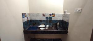 a small bathroom with a sink in a room at BYB Boutique Hotel in Thanjāvūr +90 photos