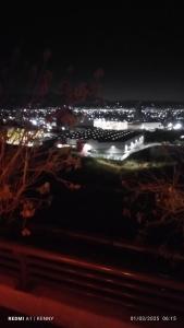 a cruise ship is lit up at night at Meny in Cedro