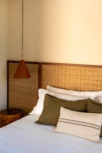 Postel nebo postele na pokoji v ubytování Botanico Villa & Suites