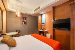 TV a/nebo společenská místnost v ubytování WISDOM Boutique Hotel Near the National Bird's Nest National ConventionCentre and Olympic Forest Park Just a 5-minute walk from Line 15's Anli Lu Subway Easy access tothe airport + 37 fotografií