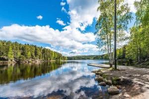 a view of a river with trees on the shore at Central home in Oslo! in Oslo