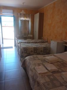 A bed or beds in a room at Beds Ar Colle