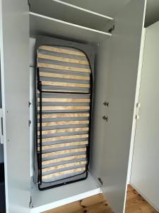 a small room with a window in the ceiling at Apartament Silver in Łańcut +3 photos