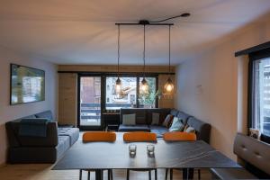 a living room with a couch and a table at Creatini Mountain in Zermatt
