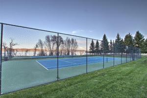 a tennis court with a chain link fence at Sunrise Resort Room #301 in Garden City
