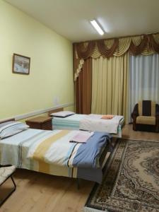Postel nebo postele na pokoji v ubytování BB Student Hotel Khust