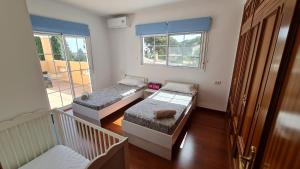 Postel nebo postele na pokoji v ubytování Villa Paraíso + 29 fotografií