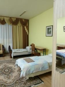 Postel nebo postele na pokoji v ubytování BB Student Hotel Khust