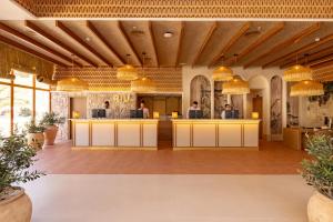 Reštaurácia alebo iné gastronomické zariadenie v ubytovaní Hotel Riu Palace La Mola