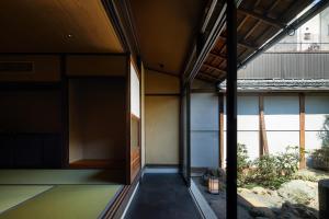 an external view of a house with a large window at Enso Machiya in Kyoto