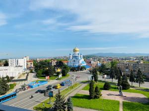 a view of a city with a building and a street at Intourist-Zakarpattia Hotel in Uzhhorod