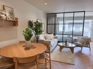 a living room with a table and a couch at Seabreeze City Studio in Kristiansand