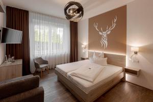 Postel nebo postele na pokoji v ubytování Hotel Kitz ehemals Schlemmerhütte