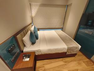 Postel nebo postele na pokoji v ubytování Hotel Flexi Residency Mumbai