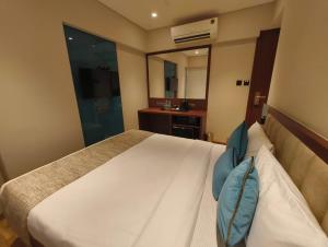 Postel nebo postele na pokoji v ubytování Hotel Flexi Residency Mumbai