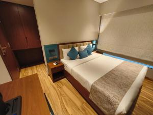 Postel nebo postele na pokoji v ubytování Hotel Flexi Residency Mumbai