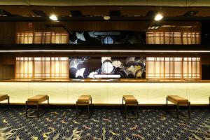 a lobby with chairs and a counter with a display at Shinjuku Prince Hotel in Tokyo