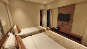 Postel nebo postele na pokoji v ubytování Hotel Flexi Residency Mumbai