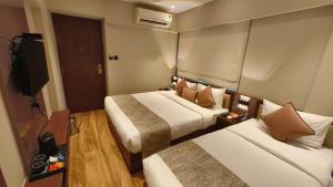 Postel nebo postele na pokoji v ubytování Hotel Flexi Residency Mumbai