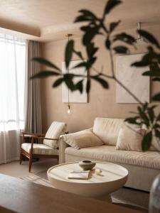 a living room with a couch and a table at Seven Letters Preface Hotel Xijiang Qianhu Miao Village in Xijiang +80 photos